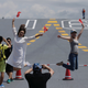 Visitors holding China and Hong Kong's flags pose for pictures on China's first aircraft carrier Liaoning during an open day at a naval base in Hong Kong, China, July 9, 2017. Picture taken July 9, 2017.